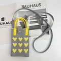 Detailed knit grey phone bag with yellow hearts and strap on a minimalist book background - Yellow Heart