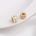 Macro shot of 14K gold plated wheel spacer beads with sparkling zircon inlay for DIY jewelry - Style 15 / 8x7mm / 14K Gold