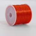 Roll of 0.7mm bright orange elastic crystal bead cord on a white plastic spool for DIY jewelry - 46m/Roll / Orange