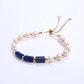 Adjustable pearl bracelet with blue lapis stone pillars and gold sliding clasp - Lapis Lazuli