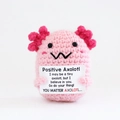 Handmade pink crochet axolotl toy holding a positive message card for encouragement - Pink Axolotl W-Mouth With Blush