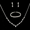 Elegant three-piece silver jewelry set with teardrop crystals on a dark background - Silver Floral Cluster Three-Piece Set (425)