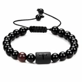 Detail of Aries obsidian beaded bracelet with adjustable cord and textured natural stone - Aries