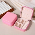 Pink portable jewelry box with ring slots and necklace hooks in a PU leather finish - Rose Pink