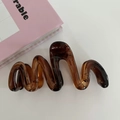 Deep brown amber wavy hair claw clip in a glossy resin finish for thick hair - Amber