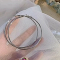 Close-up of oversized silver hoop earrings on white tulle showing polished metallic texture - 7cm / Minimalist Hoop / Silver