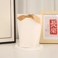 Minimalist beige wedding candy gift box with elegant gold satin bow on display tray - Large White (Textured Surface)
