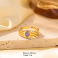 Golden titanium steel open ring featuring a teardrop blue stone and beaded wave band - Adjustable Open / Gold Beaded Wavy Edge with Teardrop Blue Stone (JOM25052)