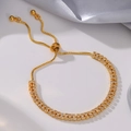 Close-up of adjustable gold tassel bracelet with double-row sparkling cubic zirconia - Double Row Zirconia / Gold