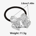 Detailoverzicht van zilveren strik haarelastiek: 3,8 cm hoog, 4,4 cm breed, gewicht 11,5g - Zilver