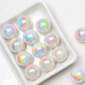 Macro shot of 16mm iridescent acrylic round beads with rainbow luster for jewelry DIY - White