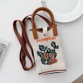 Cream knit crossbody phone bag with pumpkin pattern and brown strap on white background - Beige Pumpkin