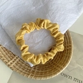 Elegant mustard yellow satin scrunchie with soft pleated texture and silk gloss finish - Golden Yellow