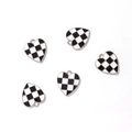 Close-up of five heart-shaped pendants with black and white checkerboard patterns - Silver Tone Black White Checkerboard Heart