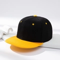 Flat brim baseball cap in black and yellow contrast design on minimalist pedestal - Black with Yellow Brim