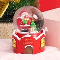 Close-up of a Christmas crystal ball with Santa Claus on a red house base decoration - Gifts and Tree (2044-3) / 8cm Music + Light