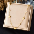 Elegant gold heart necklace with diamond accents displayed on a luxury jewelry box - Five Hearts Alternating Zirconia Style (N4100)