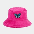 Close-up of rose pink plush bucket hat featuring a butterfly embroidery patch detail - Rose Red