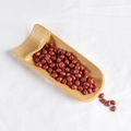 Realistic deep red PVC red bean models displayed in a minimalist long bamboo tray - Large Red Beans (500g)