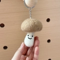Handmade mushroom wool felt keychain in beige and white with a cute smiling face - Brown Mushroom