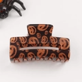 Halloween square hair claw clip featuring black base and orange glitter pumpkin pattern - Black Base Pumpkin Face