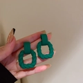 Dark green twisted geometric earrings with a matte resin finish and silver needles - Dark Green