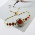 Detail of gold quartz bracelet watch with red stones and adjustable sliding chain - Gold Red