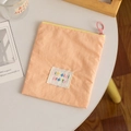 Apricot fabric cosmetic pouch with yellow zipper and jiméizi pretty logo on white table - Orange (Vertical)