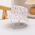 Detail of floral infant bucket hat with pink flower patterns and white chin strap - Small Floral Red