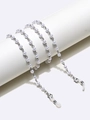 Close-up of pearl eyewear chain with silver metal links and silicone loops on display - Silver