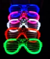 Close-up of five colorful LED shutter glasses in blue, pink, white, red, and green colors - Shutter / White