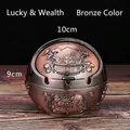 Spherical bronze ashtray with lid, featuring embossed floral patterns and 10cm diameter - Red Copper Wealth Luck