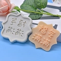 Macro detail of wave-edge silicone mold and pink resin craft with Chinese blessings - Fu Character Blessing Necklace