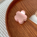 Pink flower-shaped hair claw clip placed on a wooden tray for elegant hair styling - Pink Flower Style(FJ277)
