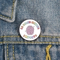 Detail of Mental Health Matters enamel pin on blue denim jacket with colorful Spanish text - XZ4797-Spanish Mental Health Brain