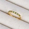 Macro shot of 18K gold plated ring featuring a row of sparkling green zircon gemstones - A Row Of Small Green Gemstones Ring (款式15)