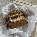 Detailed view of large brown marble pattern resin hair claw clip with metal spring - Yellow Ink Wash Effect