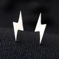 Macro view of silver lightning bolt stud earrings with polished minimalist finish - Flash / Silver
