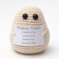 Handmade beige crochet positive potato doll holding an inspirational message card - Premium Potato Beige