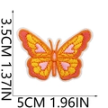 Detailed view of bohemian embroidered butterfly patch in vibrant orange and yellow colors - Style 16 (Orange Yellow Butterfly)