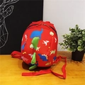 Cute red dinosaur backpack for kids featuring colorful cartoon prints and 3D green spikes - Red