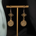Detailed close-up of retro bohemian gold coin drop earrings with ethnic geometric patterns - Antique Gold Earrings (S3360-2)
