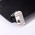 Macro view of stainless steel dog tag keychain with engraved text and fishing silhouette - Style 8 (Father & Daughter Fishing)