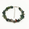 Macro view of natural green epidote and moss agate stone bracelet with adjustable silver clasp - India Agate