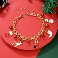 Detailed shot of Christmas bracelet with bells and charms on a festive red background - D1242 (Christmas Sock Snowman)