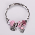 Detail of silver beaded bracelet with pink charms and sparkling evil eye pendant - Pink