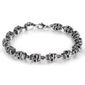 Detailed macro view of silver skull punk bracelet with polished steel finish and lobster clasp - Skull Five / Silver