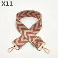 Detail of red and white chevron canvas bag strap with gold metal hooks and buckle - Red