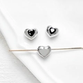 Macro detail of heart-shaped spacer beads with black enamel and 18k gold plating - 10# White Gold - Black Zircon