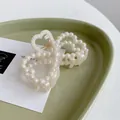 Elegant cream white pearl hair claw clip in a heart-shaped design for women's hairstyles - Double Heart Pearl